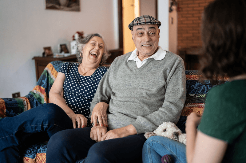 Grandparents and granddaughter talking at home - stock photo
Grandparents and granddaughter talking at home