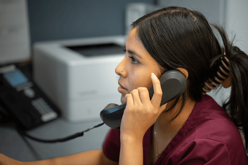 Female office provider on the phone